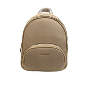 Beige backpack on a white surface with a blurred background