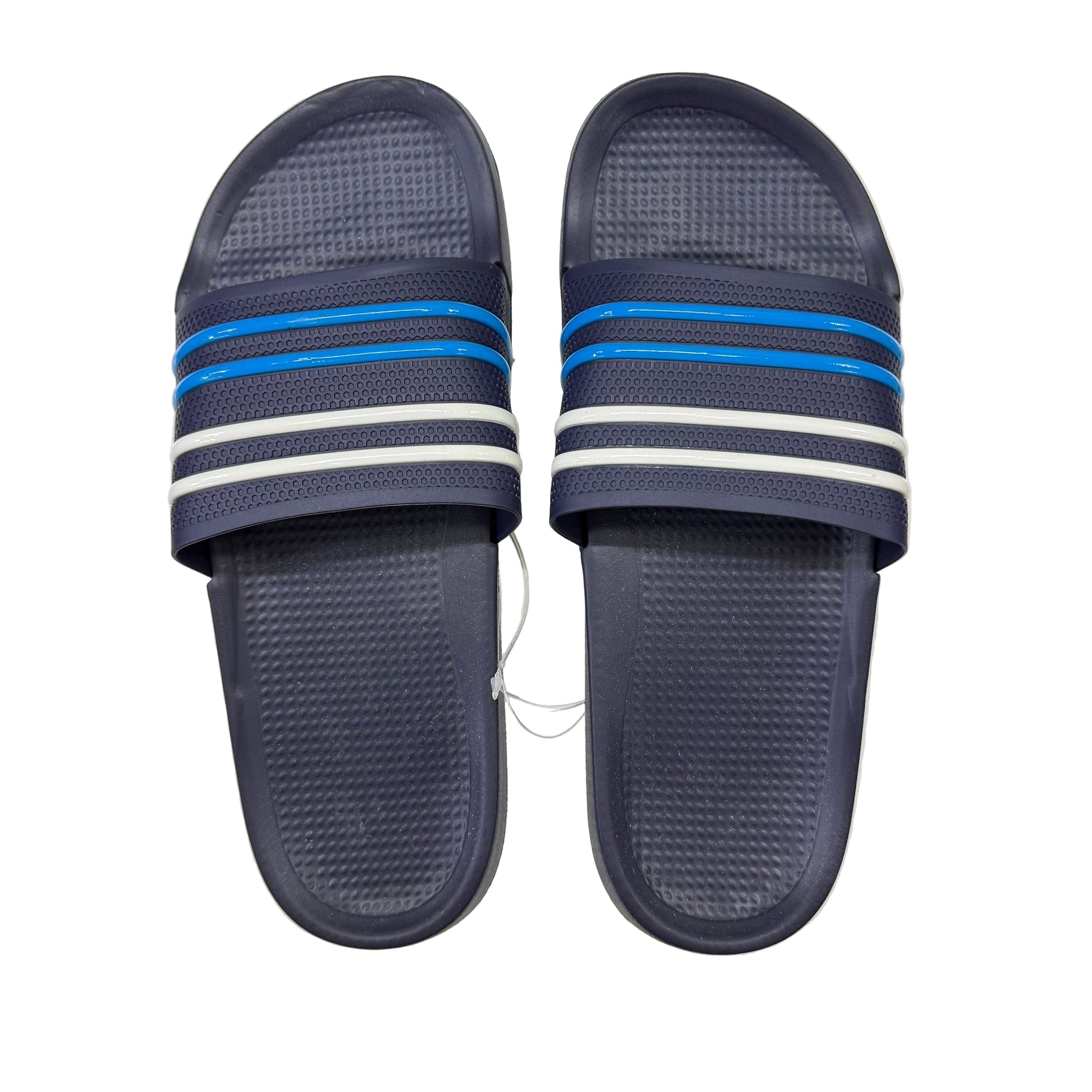 Pair of navy blue slides with white and blue stripes on a white box.
