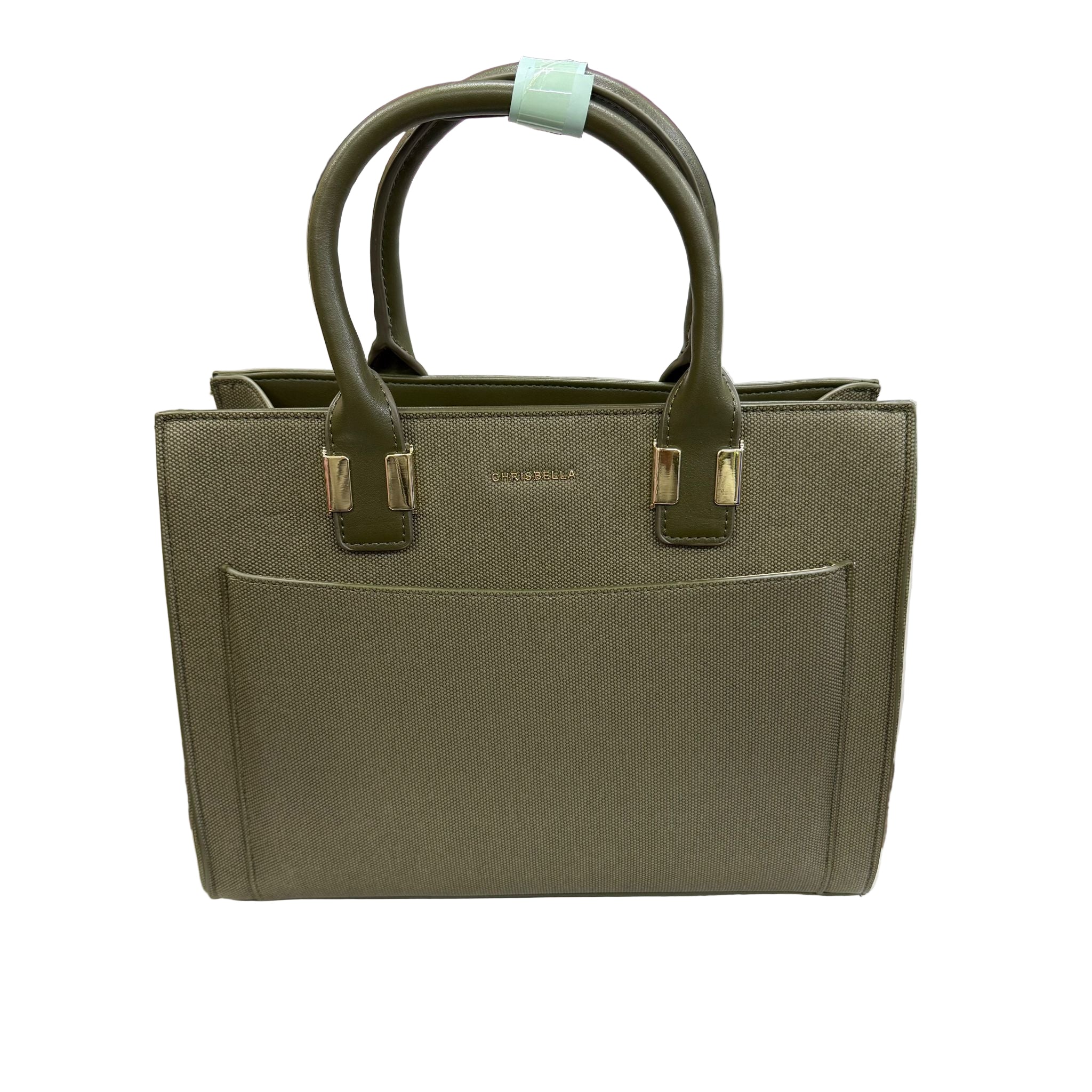 Green handbag on a white surface with a blurred background